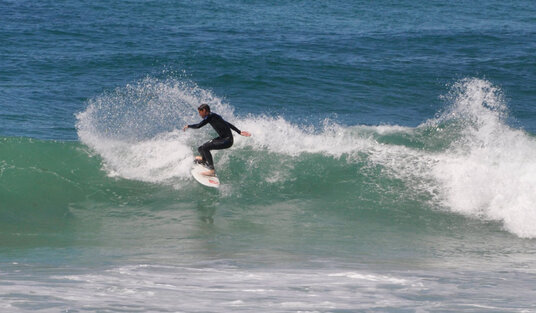 Surfer at Constantine Bay