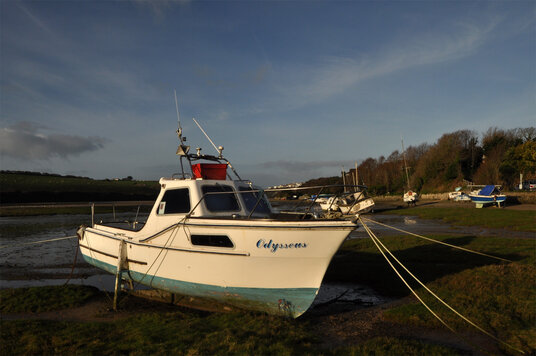 Boats beached at low tide