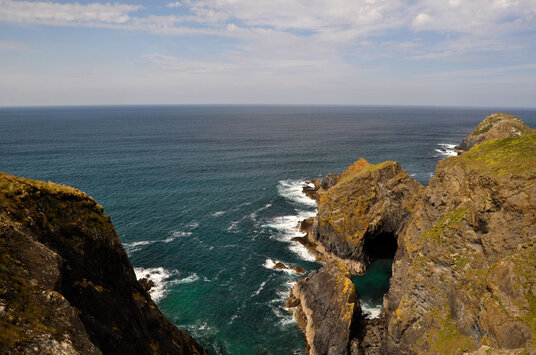 Sea cave in an island off Penhale Point