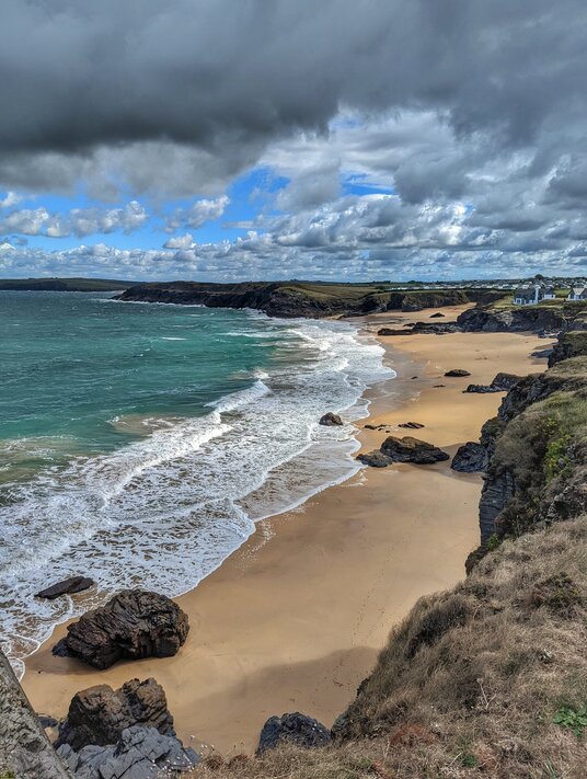 Coast path view across Mother Ivey's Bay