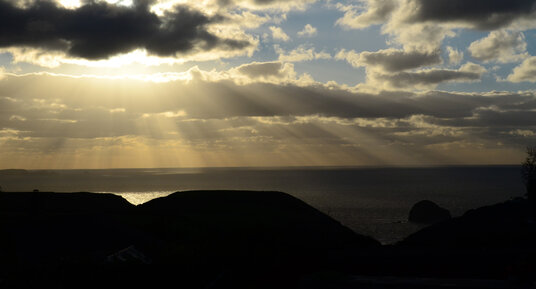 Sunset over Trebarwith Strand from Trewarmett