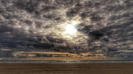 Sun setting over Perranporth Beach