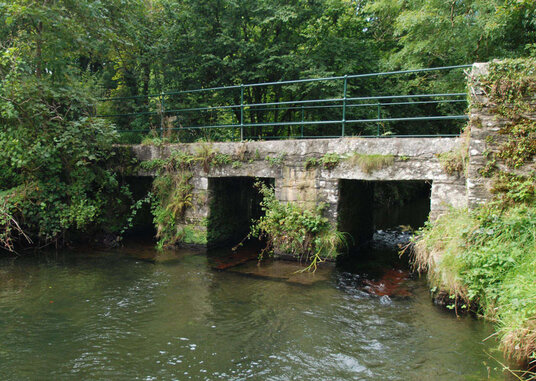 Clapper bridge over the mill leat