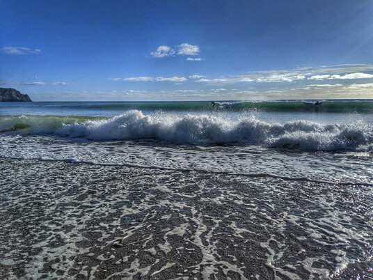 Surfers at Pendower Beach