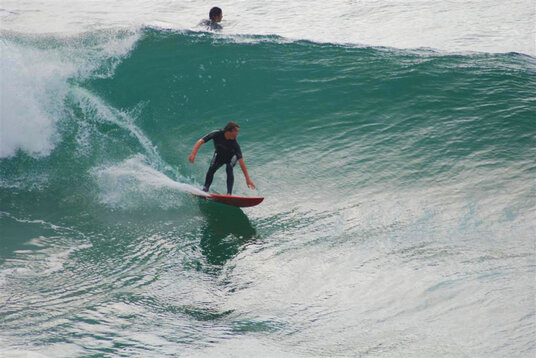 Surfer at Trebarwith Strand