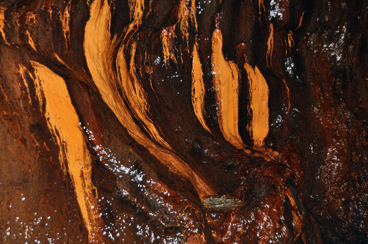 Coloured rocks in a cave at Tregardock