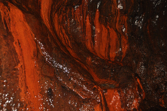 Iron-stained rocks in the cave