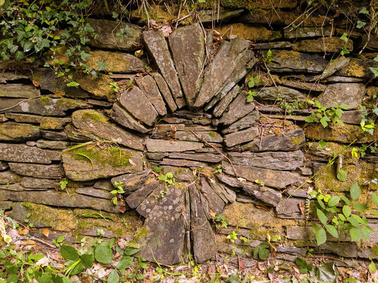 Celtic cross in a drystone wall
